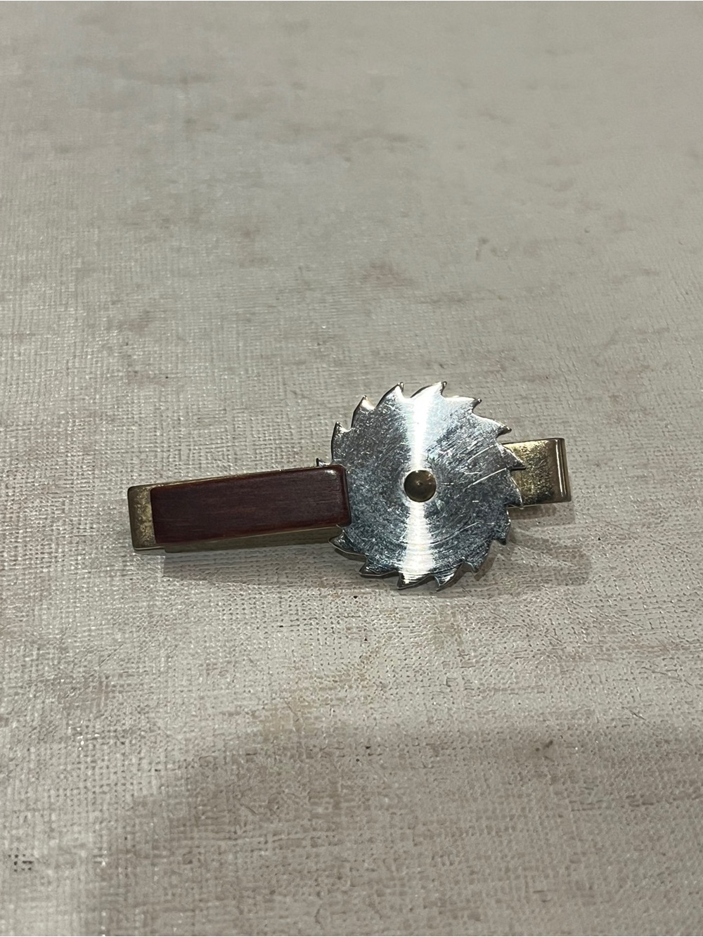 Vintage rotating Silver Saw Blade Tie Clip with Wood Accent. So cool!